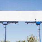 big-blank-advertising-hoarding-against-blue-background