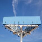 low-angle-view-blue-big-hoarding-pole-with-light-against-blue-sky (2)